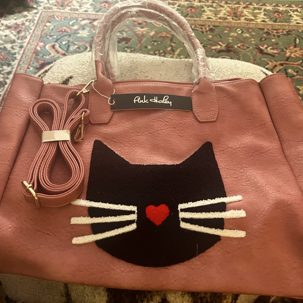 A great shade of pink "Oh Baby Oh" tote w extra shoulder strap Holds MediumLarge